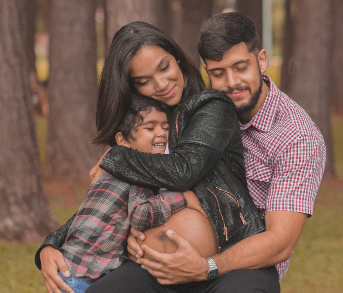 Pregnant couple with kid