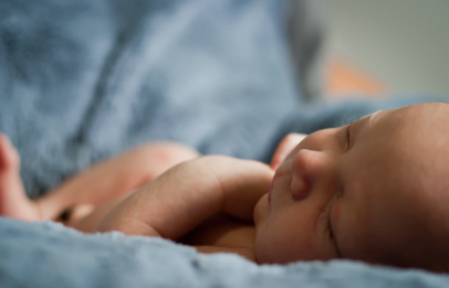 Sleeping baby on bed