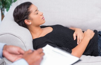 Pregnant woman on couch