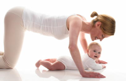 Baby doing yoga with mom