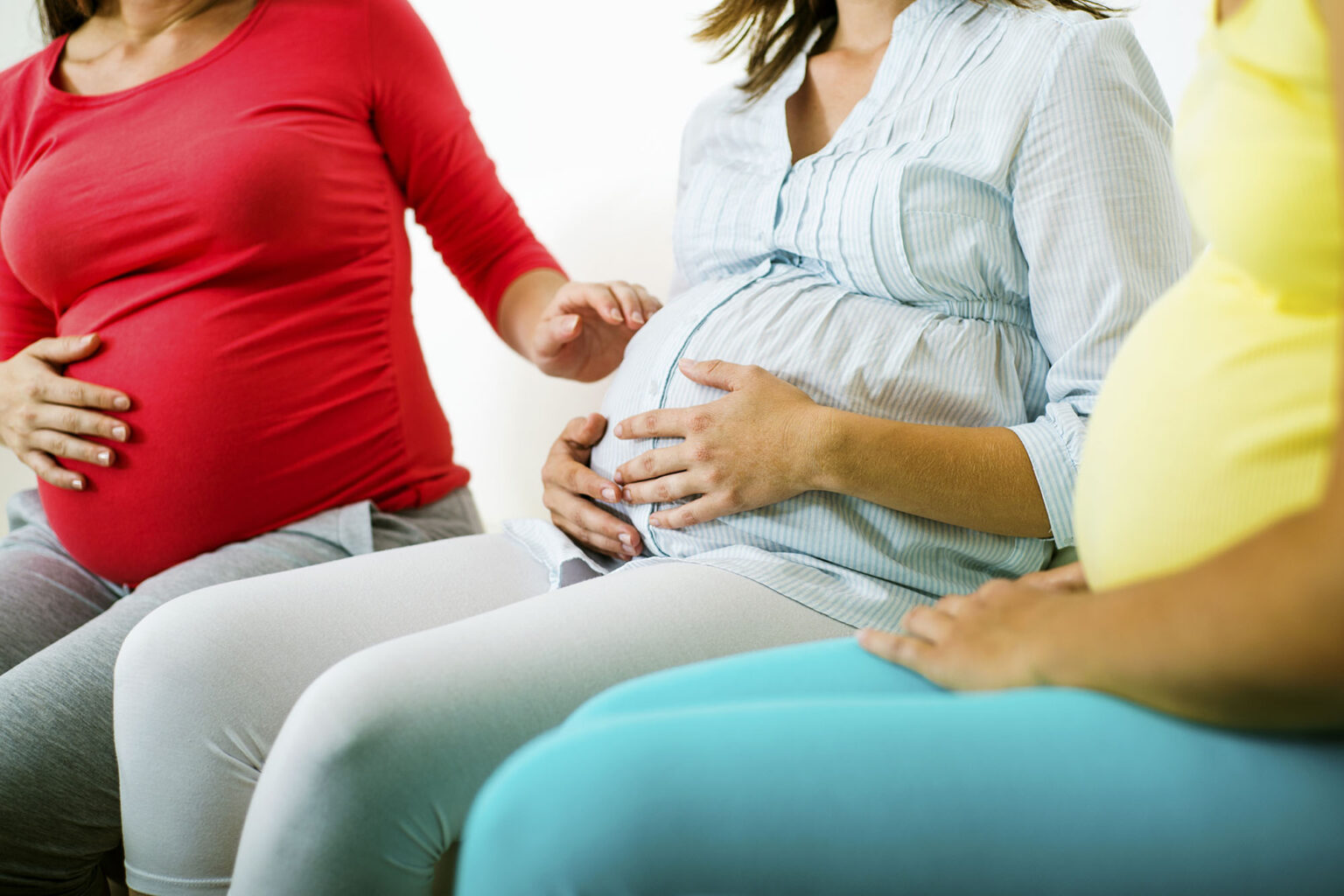 Pregnant women sitting together having a conversation